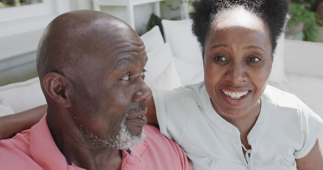 Happy Senior Couple in Relaxed Home Environment