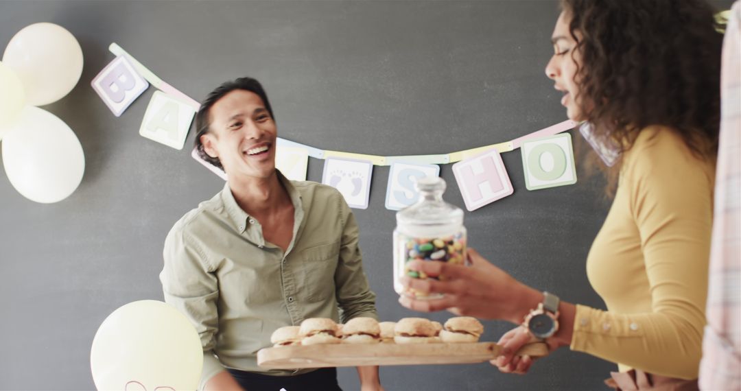 Colleagues Preparing Decor and Food for Office Celebration
