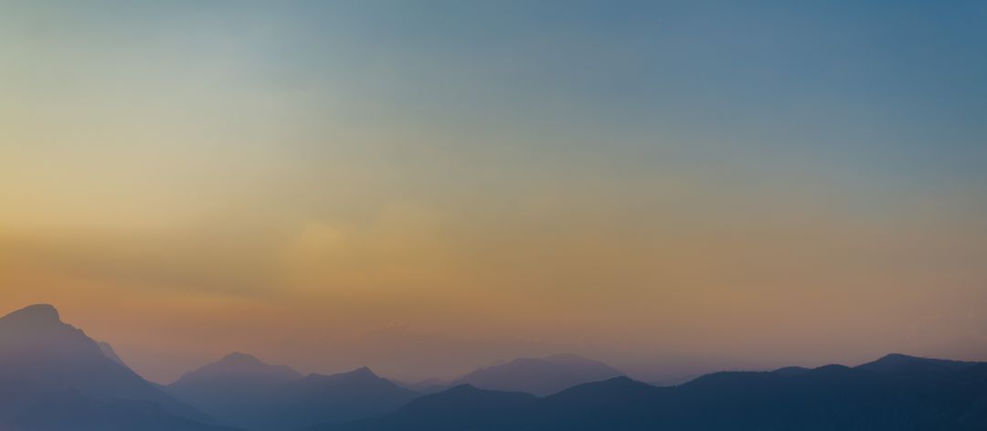 Calming Mountain Landscape with Sunset Colors on Horizon - Free Images, Stock Photos and Pictures on Pikwizard.com