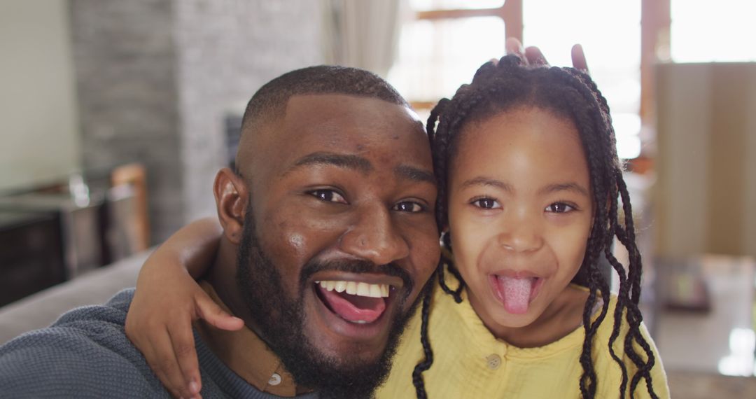 Joyful Father and Daughter Having Fun at Home
