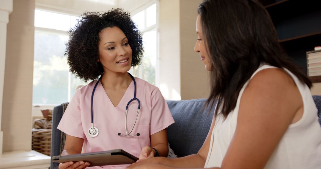Friendly Nurse Discussing Health Information with Patient Using Tablet