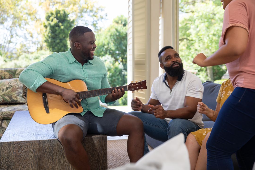 Diverse Group Enjoying Music and Friendship at Home
