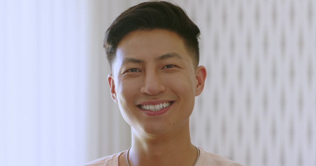 Joyful Smiling Man Celebrating at Home