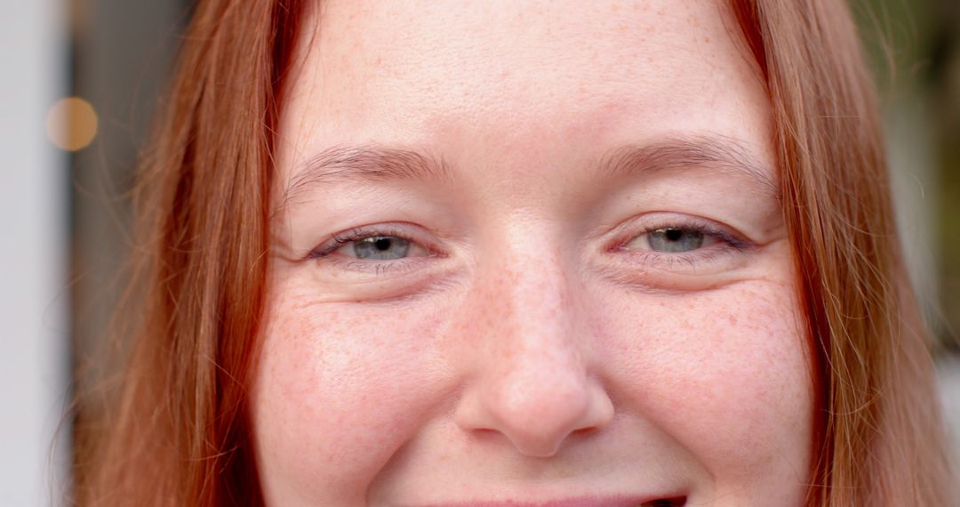 Close-Up Portrait of Freckled Woman with Red Hair