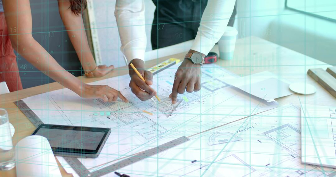 Architects Collaborating on Blueprints in Modern Design Studio