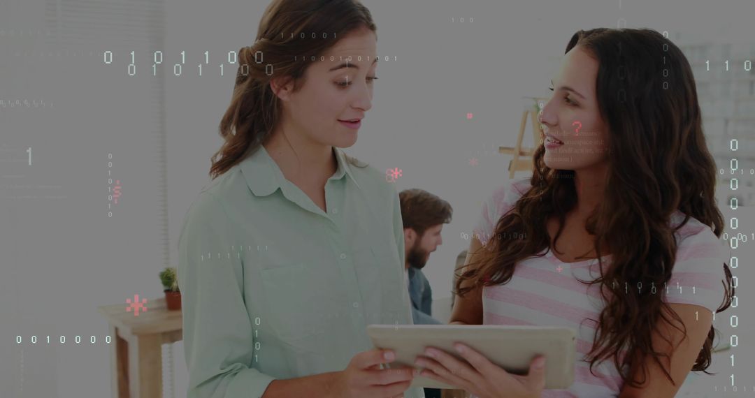 Two colleagues collaborating over tablet with digital binary overlay in modern office