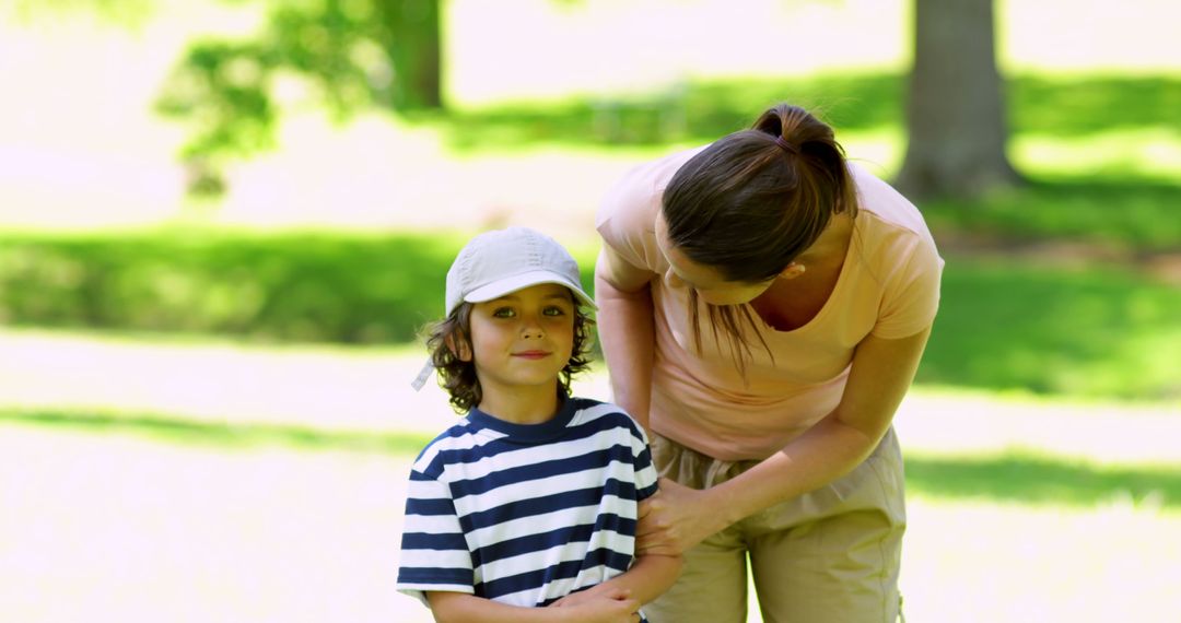 Mother Interacting with Son in Sunny Park - Free Images, Stock Photos and Pictures on Pikwizard.com