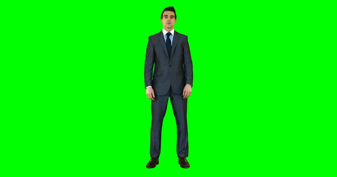 Businessman in Formal Suit Posing on Green Screen Background - Free Images, Stock Photos and Pictures on Pikwizard.com