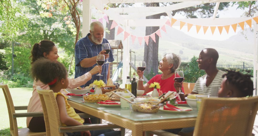 Diverse Family Enjoying Sunny Backyard Dining Experience - Free Images, Stock Photos and Pictures on Pikwizard.com