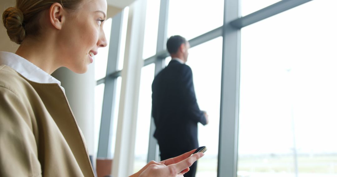 Professionals Waiting in Modern Office Building, Using Smartphone - Free Images, Stock Photos and Pictures on Pikwizard.com