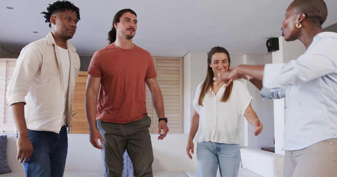 Interracial Group Engaged in Lively Conversation at Home