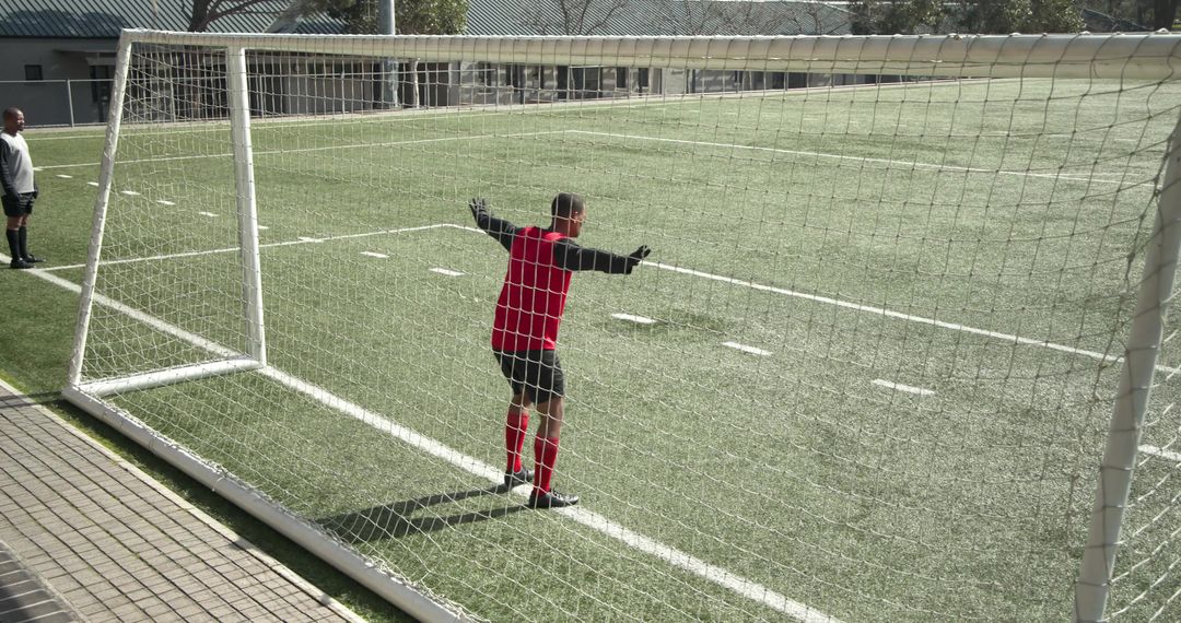 Goalkeeper Focusing Before Play on Soccer Field