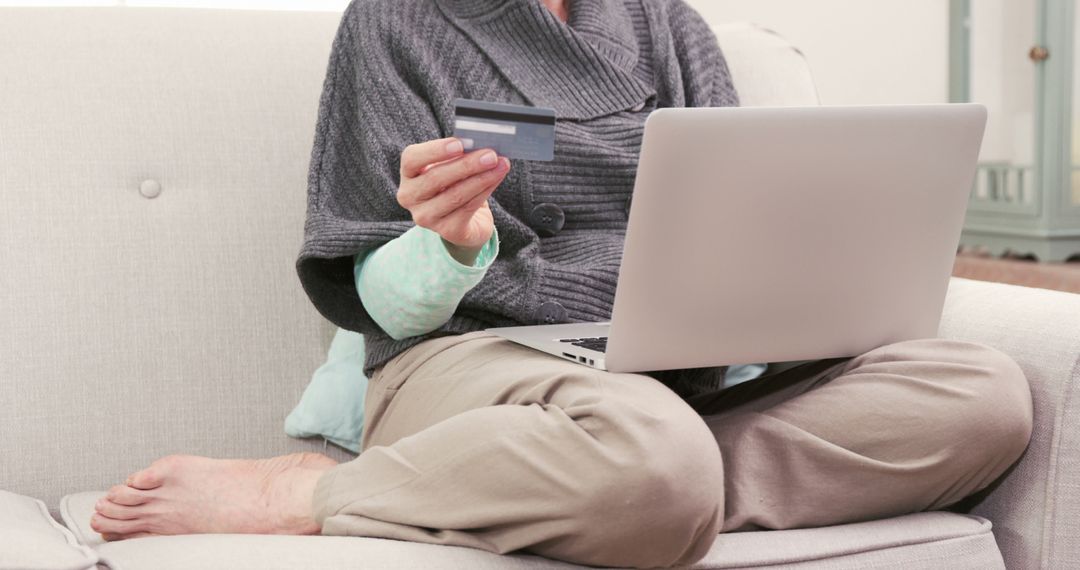 Senior Woman Shopping Online with Credit Card on Sofa - Free Images, Stock Photos and Pictures on Pikwizard.com