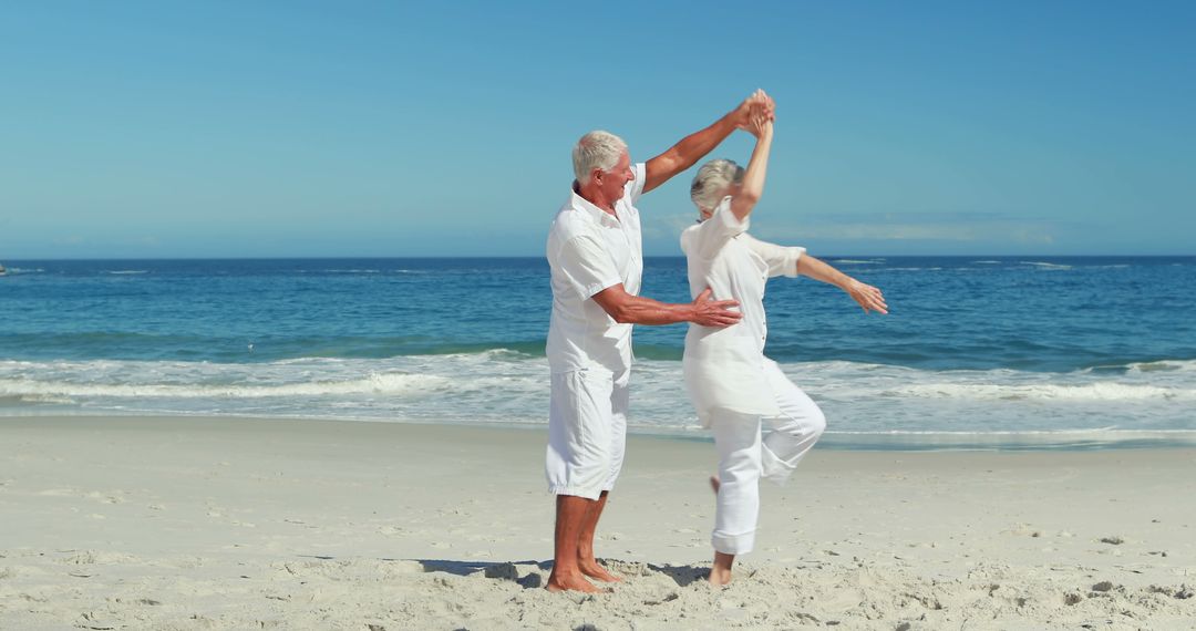 Senior couple dancing on the beach - Free Images, Stock Photos and Pictures on Pikwizard.com