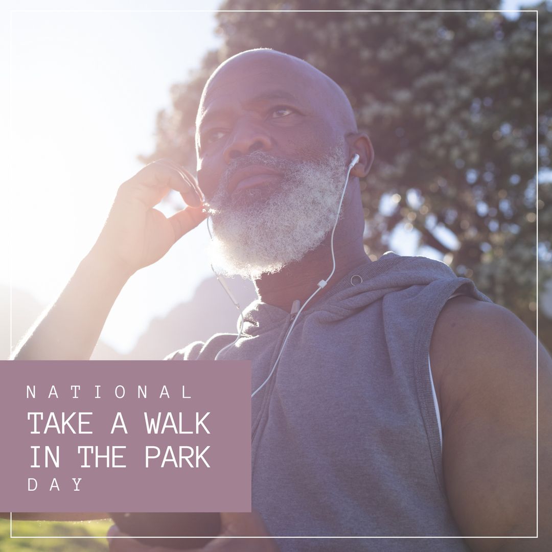 Man Enjoying a Peaceful Walk in Sunny Park with Earphones