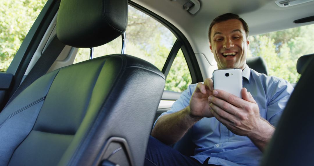 Businessman Working on Smartphone in the Backseat of a Car - Free Images, Stock Photos and Pictures on Pikwizard.com