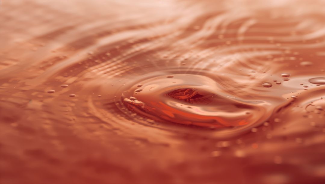 Macro Amber Liquid Ripple Forming Droplet Crown with Glossy Reflections and Warm Highlights