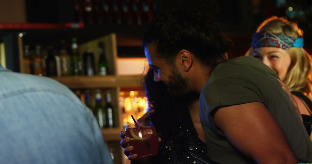 Young Adults Socializing at Lively Bar Gathering