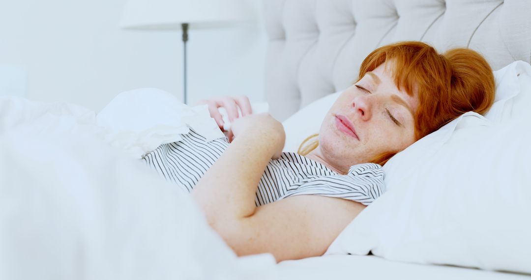 Woman with Red Hair Peacefully Sleeping in Bed - Free Images, Stock Photos and Pictures on Pikwizard.com