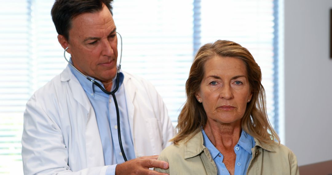 Doctor Checking Senior Woman's Heartbeat During Medical Exam - Free Images, Stock Photos and Pictures on Pikwizard.com