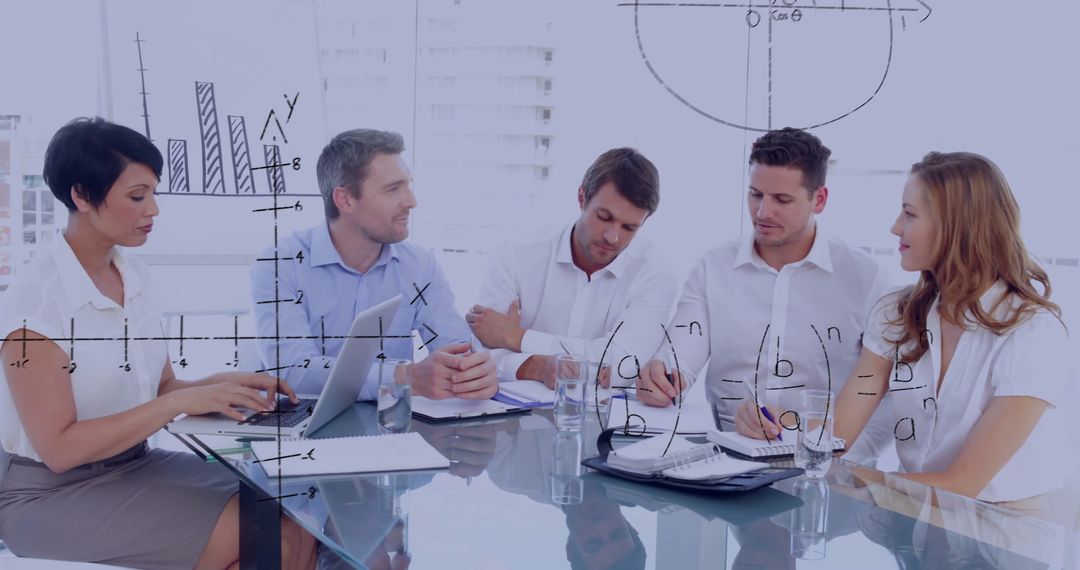 Business Professionals Analyzing Data During Corporate Meeting