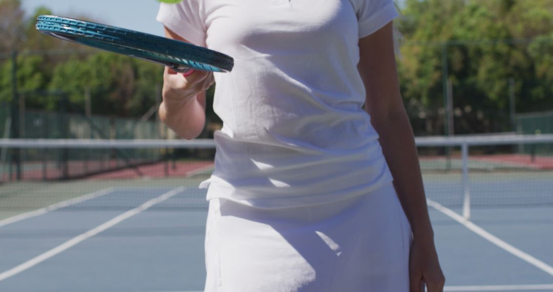 Tennis Player Holding Racket Ready for Game - Free Images, Stock Photos and Pictures on Pikwizard.com