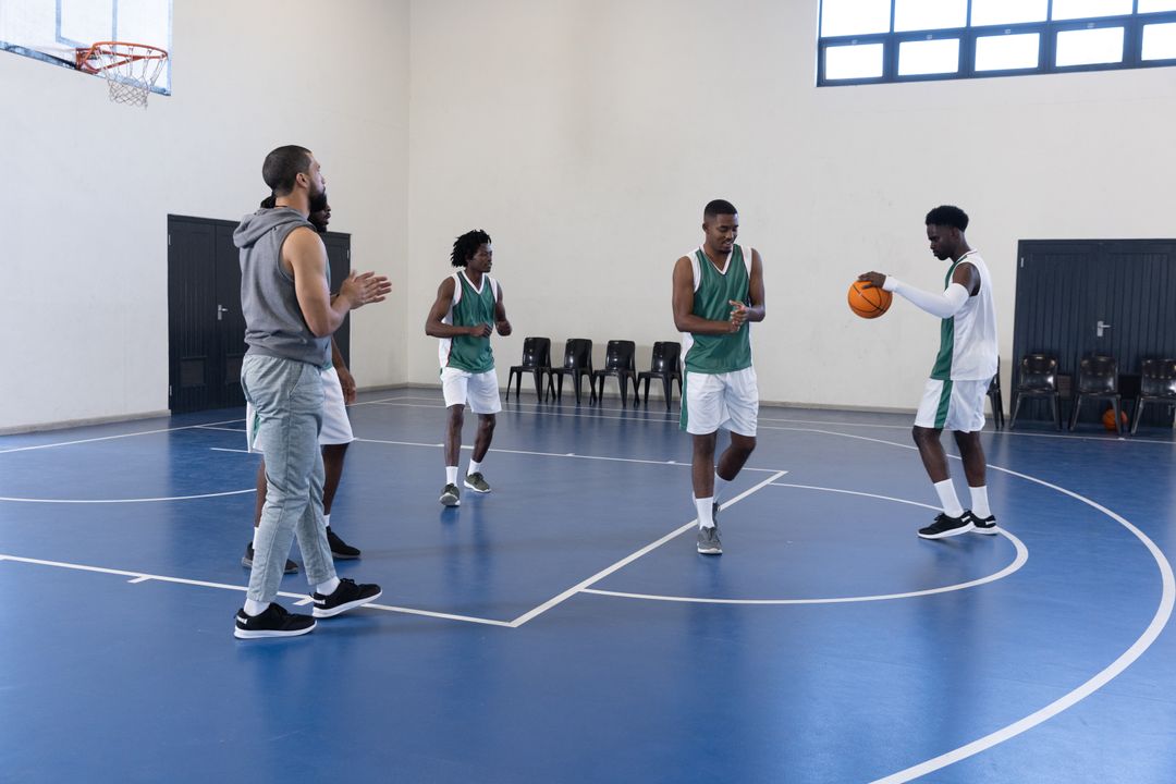 Training Basketball Team Practicing Passing Drills on Indoor Court