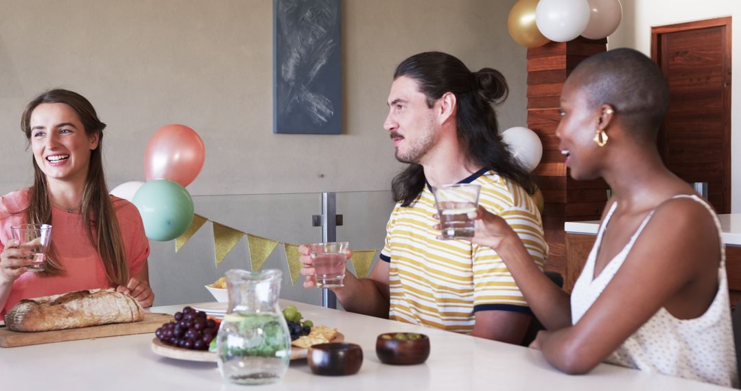 Friends Socializing at Dining Table During Casual Gathering