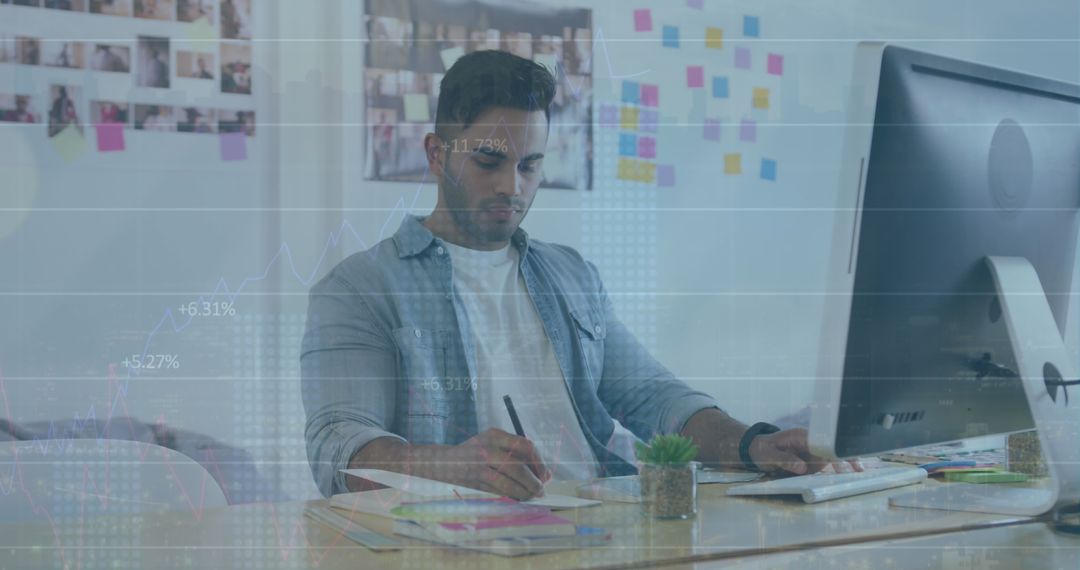 Businessman Analyzing Financial Data on Computer in Modern Office