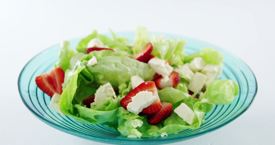 Fresh Green Salad with Strawberries and Feta Cheese in Clear Glass Bowl - Free Images, Stock Photos and Pictures on Pikwizard.com