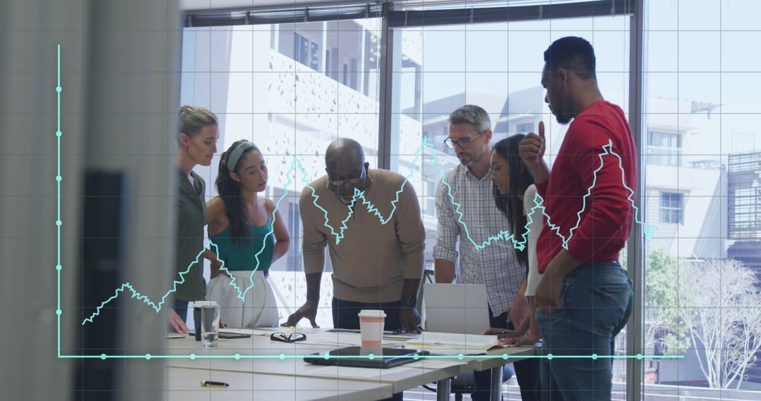 Diverse Business Team Analyzing Financial Graph in Office