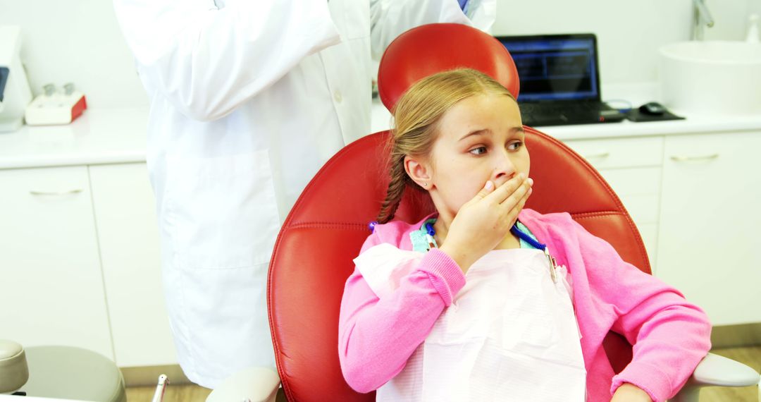 Young patient scared during a dental check-up at clinic - Free Images, Stock Photos and Pictures on Pikwizard.com