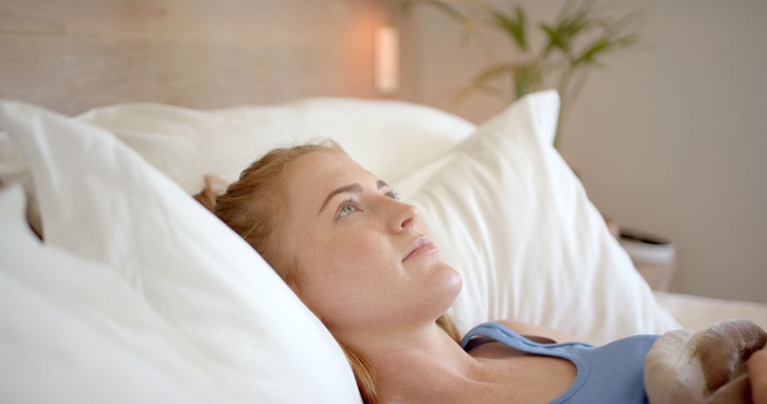 Peaceful Woman Relaxing in Comfortable Bedroom Environment