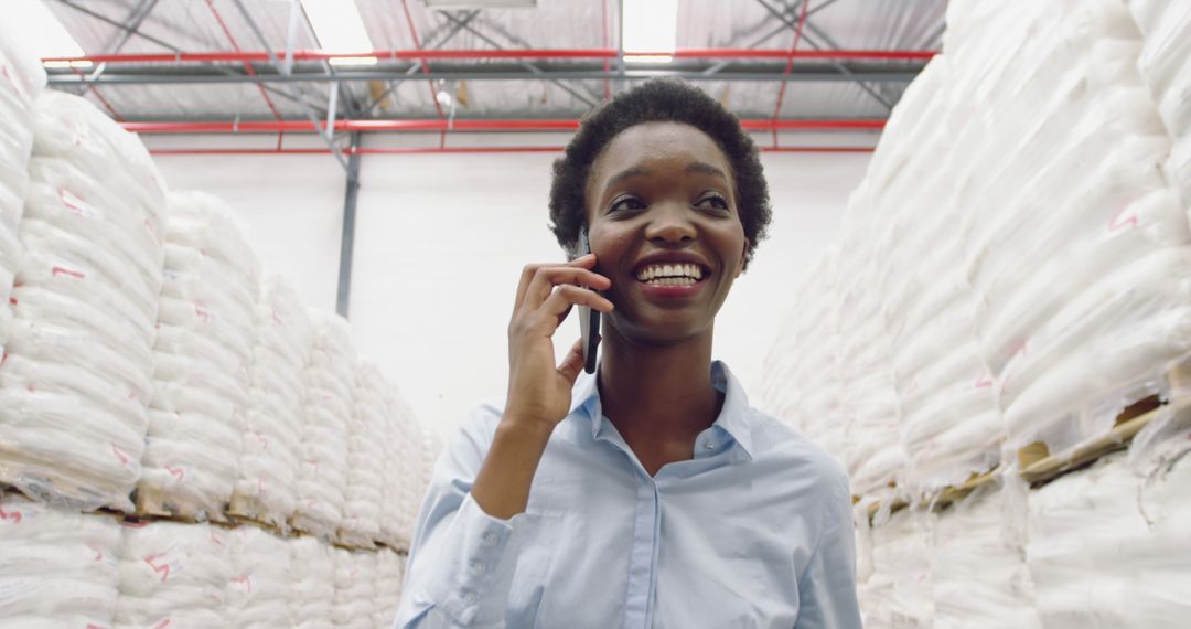 Businesswoman on Phone in Warehouse with Stock - Free Images, Stock Photos and Pictures on Pikwizard.com