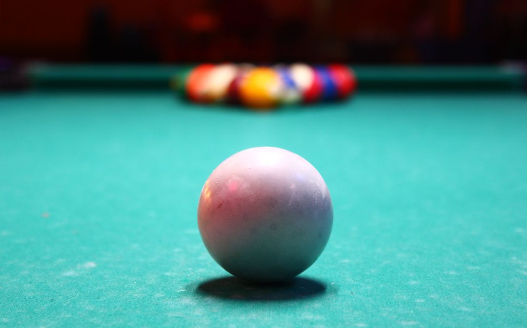 Close-Up of Cue Ball on Billiard Table with Racked Balls in Background - Free Images, Stock Photos and Pictures on Pikwizard.com