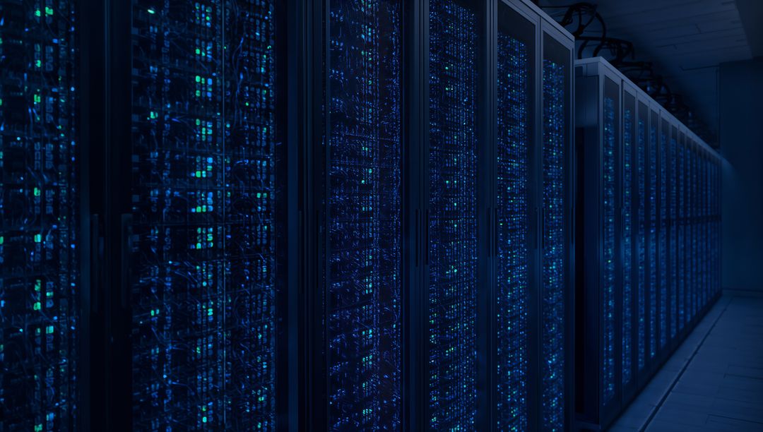 Glowing server racks stretching down data center aisle with blue LED network lights
