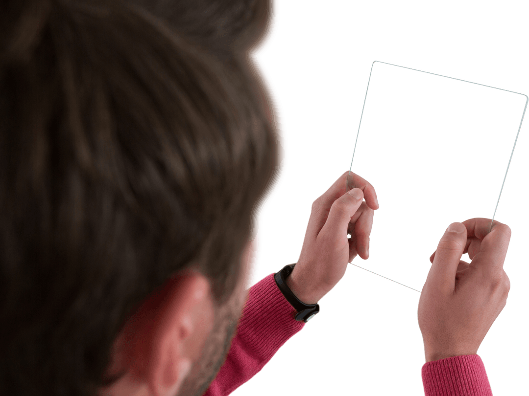 Man Holding Transparent Tablet Screen with Focused Expression