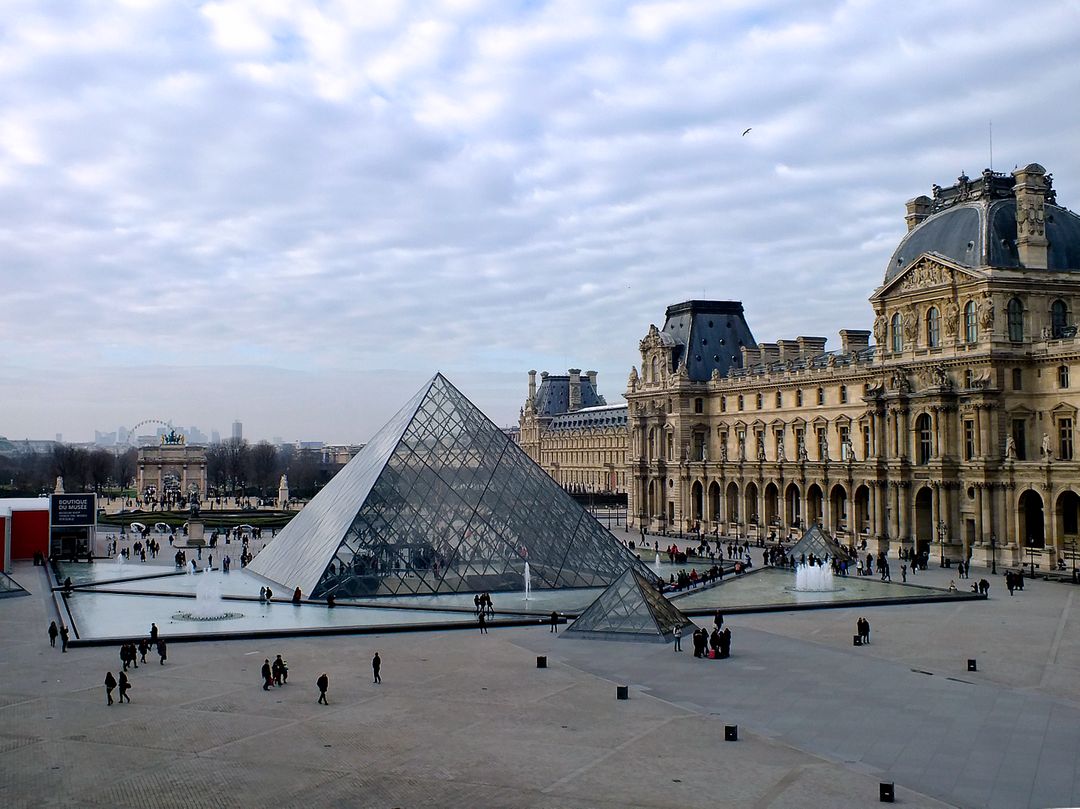 Louvre Museum with Glass Pyramid in Morning Light - Free Images, Stock Photos and Pictures on Pikwizard.com