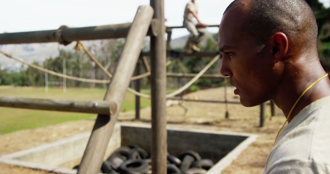 Focused African American Man at Rugged Obstacle Course Training
