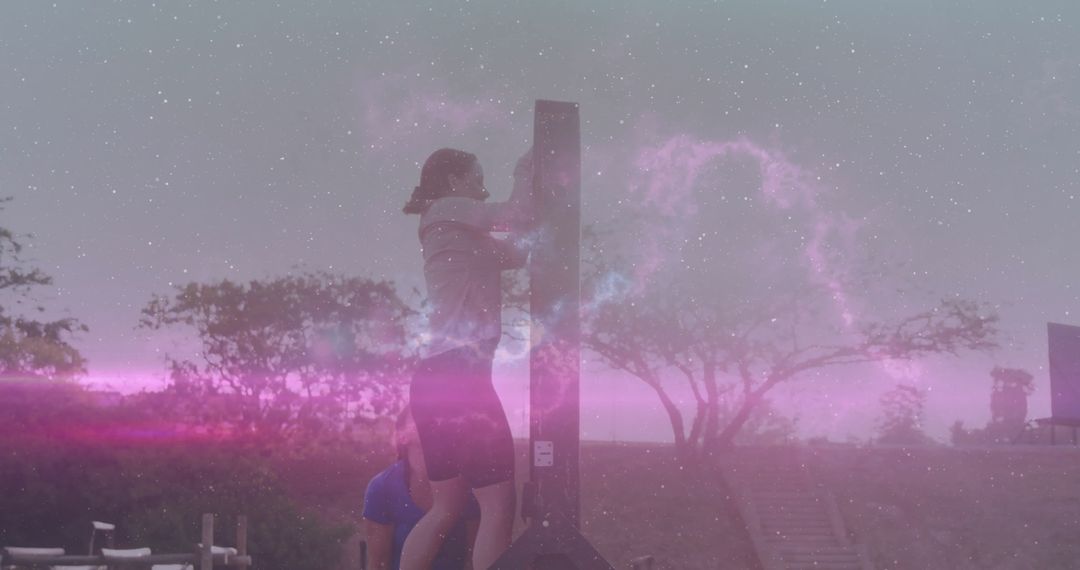 Athlete Climbing Pillar with Spotter in Outdoor Fitness Course