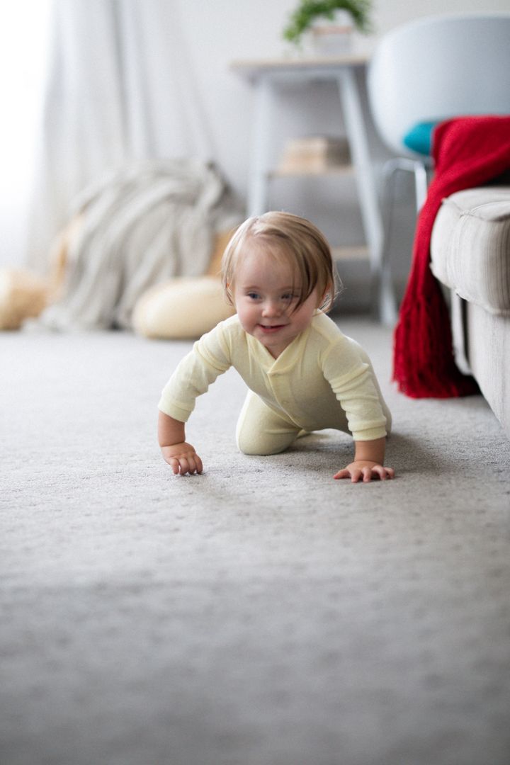 Happy Baby Crawling on Carpet in Cozy Living Room - Free Images, Stock Photos and Pictures on Pikwizard.com