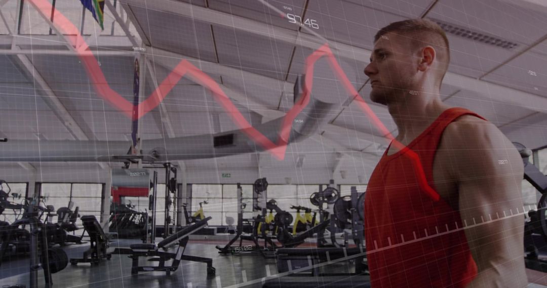 Man in Sportswear with Graph Overlay in Modern Gym
