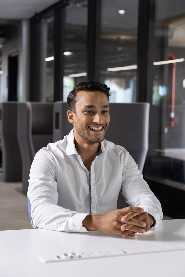 Professional Asian Man in Modern Office Environment