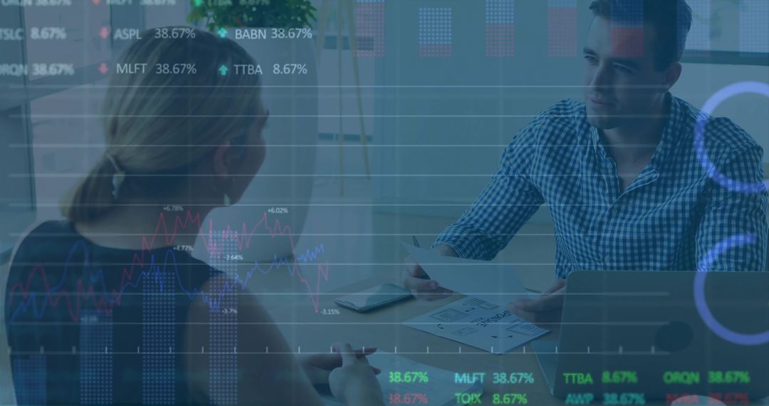 Colleagues Strategizing on Stock Market Analysis in Modern Office