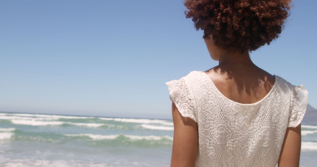 Tranquil Beach Scene with Woman in White Dress - Free Images, Stock Photos and Pictures on Pikwizard.com