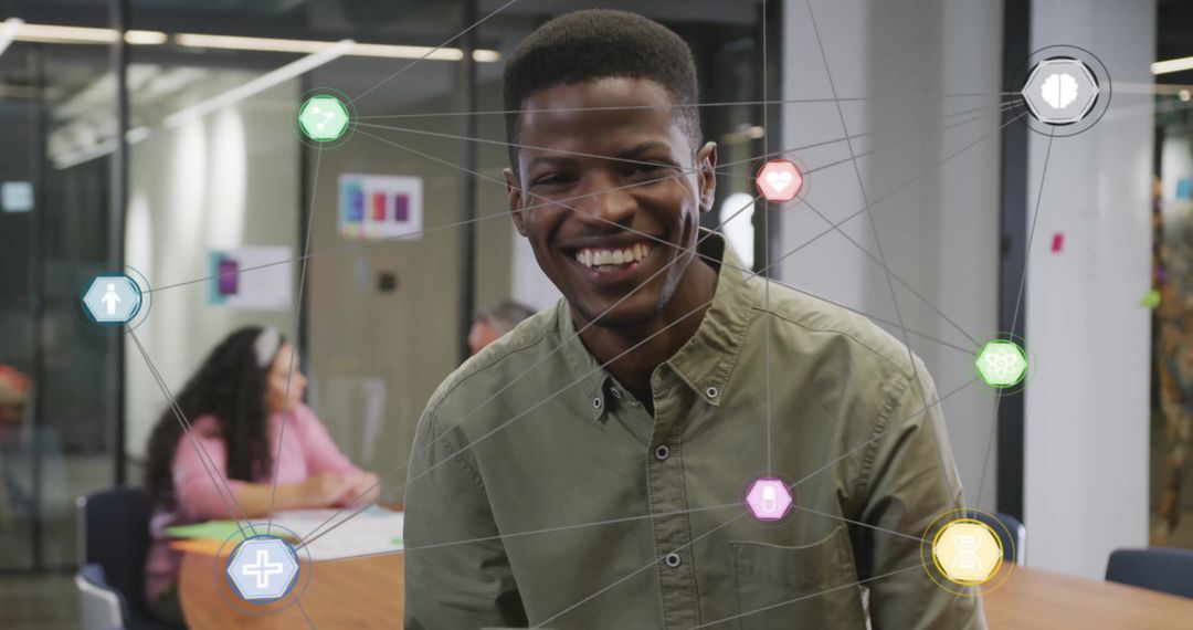 Smiling Professional Amidst Digital Technology Icons in Office