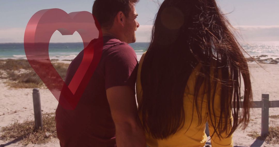 Romantic Couple Relaxing by the Sea with Heart Graphic Adjacent