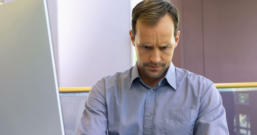 Focused Man Working in Office on Computer - Free Images, Stock Photos and Pictures on Pikwizard.com