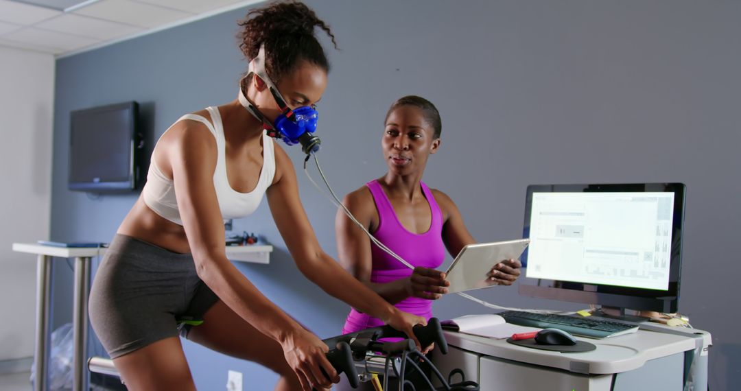 Athlete Undergoing VO2 Max Cardio Test with Professional Healthcare Worker - Free Images, Stock Photos and Pictures on Pikwizard.com