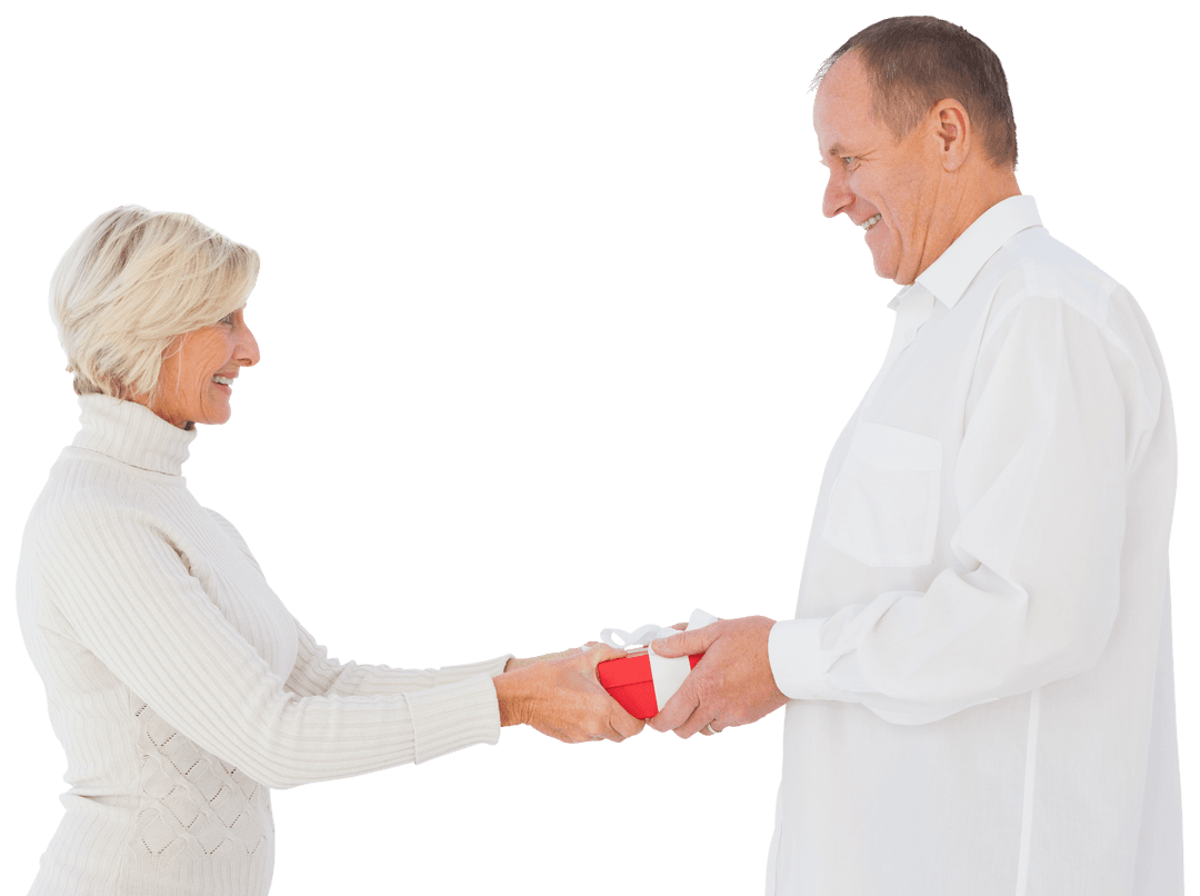 Senior Couple Exchanging Gift with Joyful Expressions Transparent